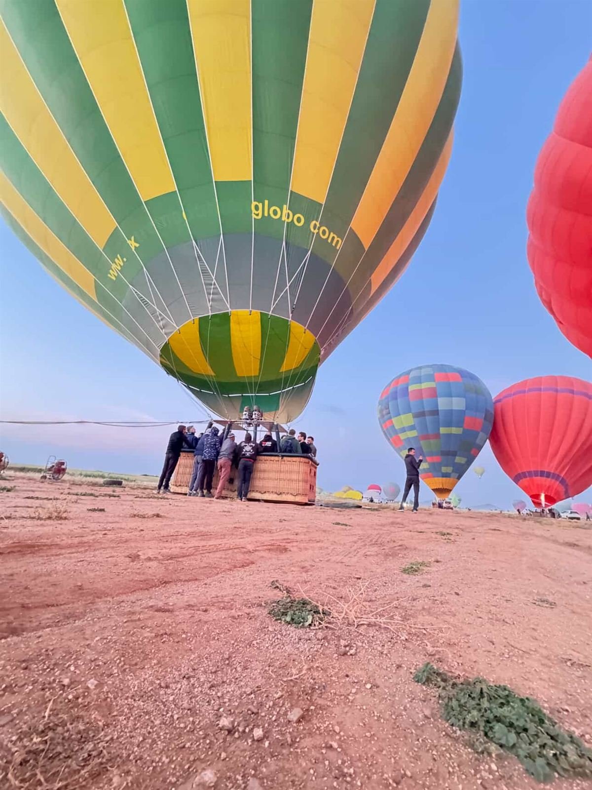 Our pilot and crew preparing a hot air balloon on the launch field near Marrakech